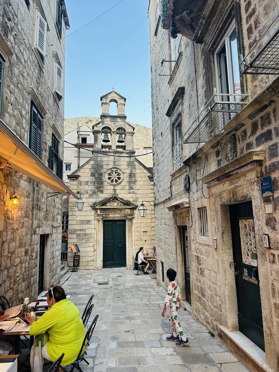 Dubrovnik Old Town alley toward a church facade