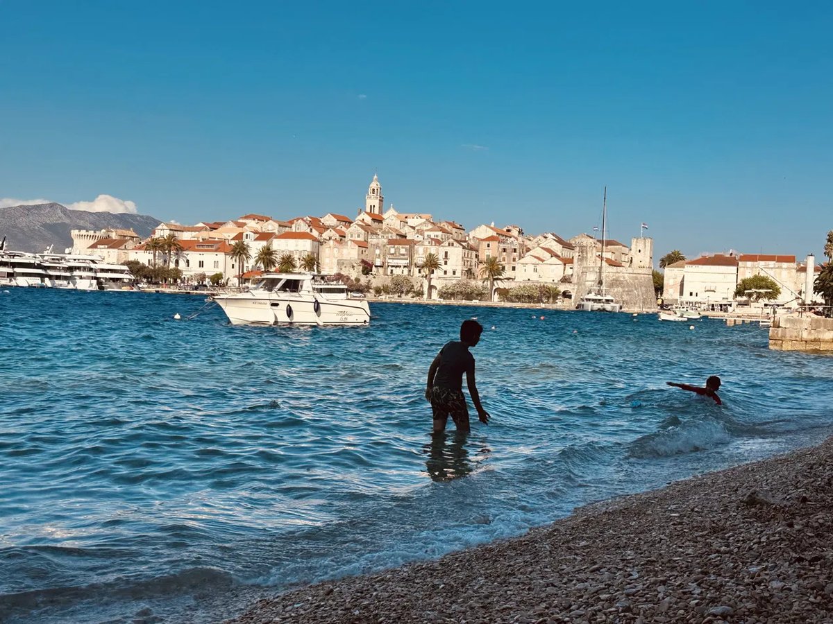 Playing ball in the water at the beach closest to Korčula's Old Town