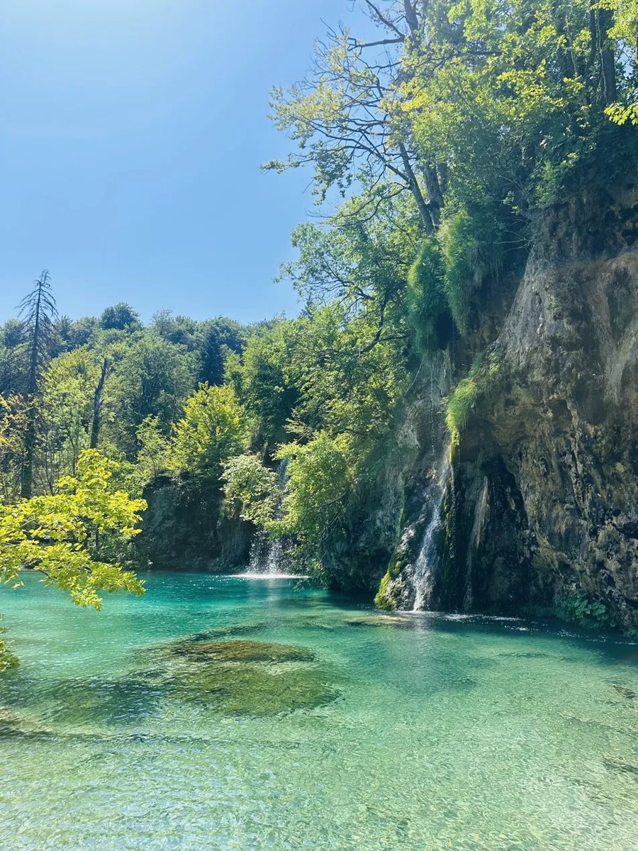 Waterfall into a turquoise pool at Plitvice