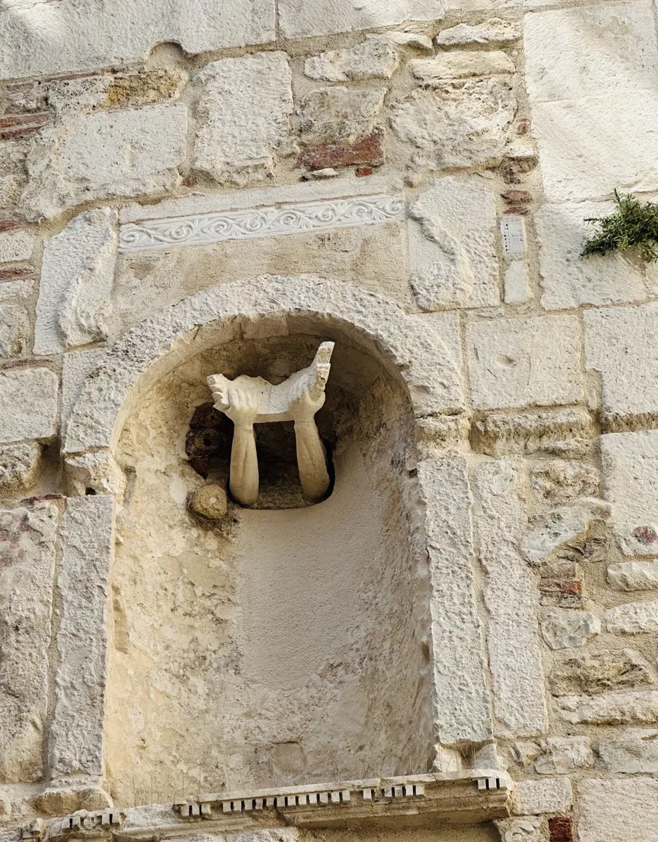 Weathered stone relief carving in Trogir